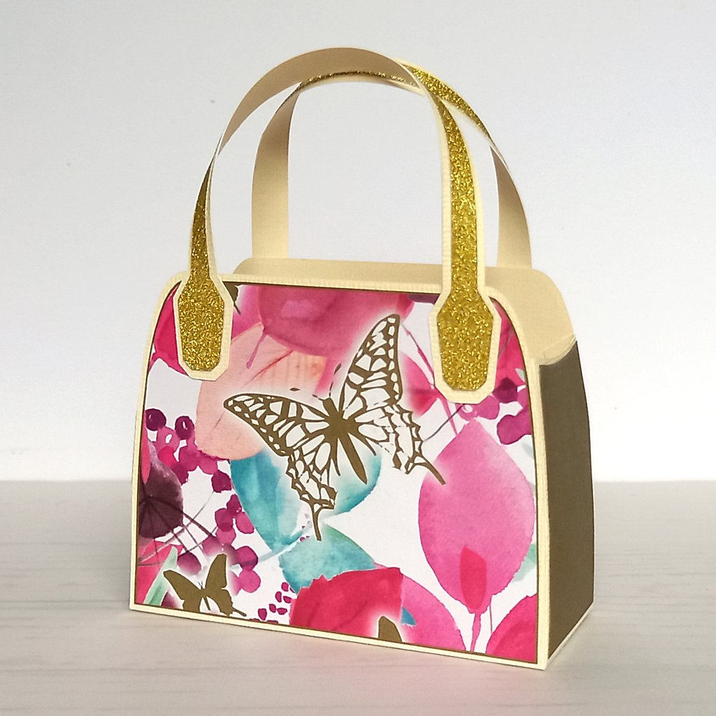 Pink upcycled favour bag with gold butterfly design