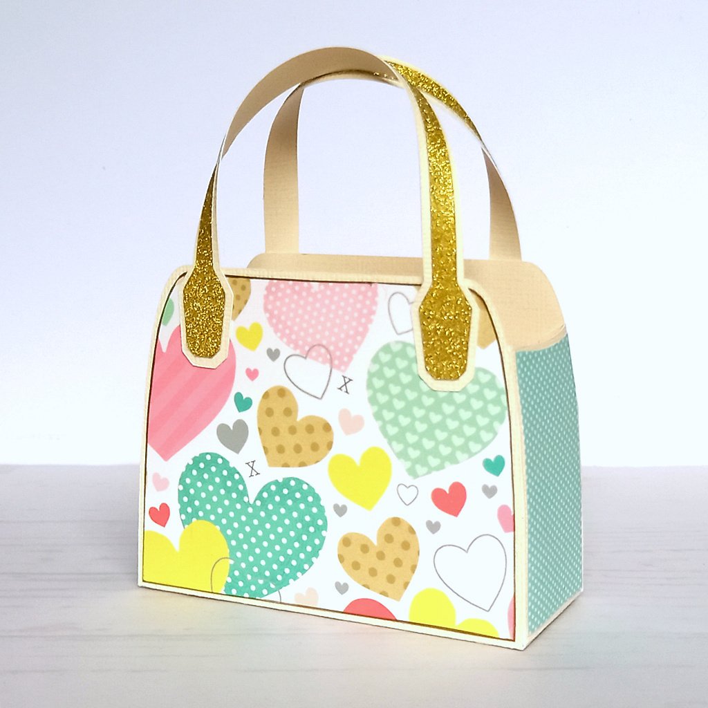 White upcycled favour bag with pastel heart design