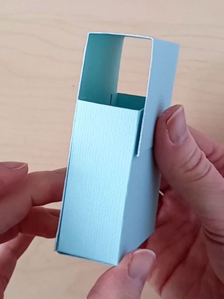 The side of a business card holder made from mint green cardstock used to hold 70 business cards