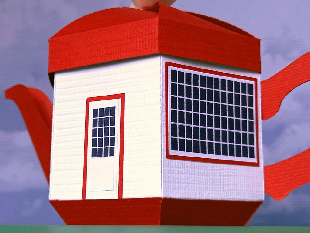 A small papercraft teapot gift box made in the style of the teapot dome gas station with a white body a red lid a red handle and spout and tiny black windows