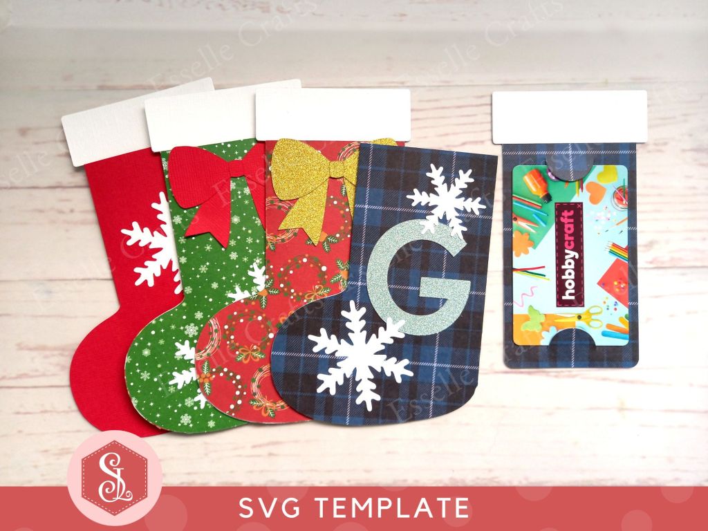 Four festive paper craft gift card holders in the shape of Christmas stockings decorated with snowflakes and bows