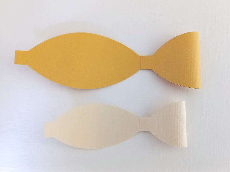 A princess crown bow made from gold glitter cardstock that can be used on gift packaging or home decor