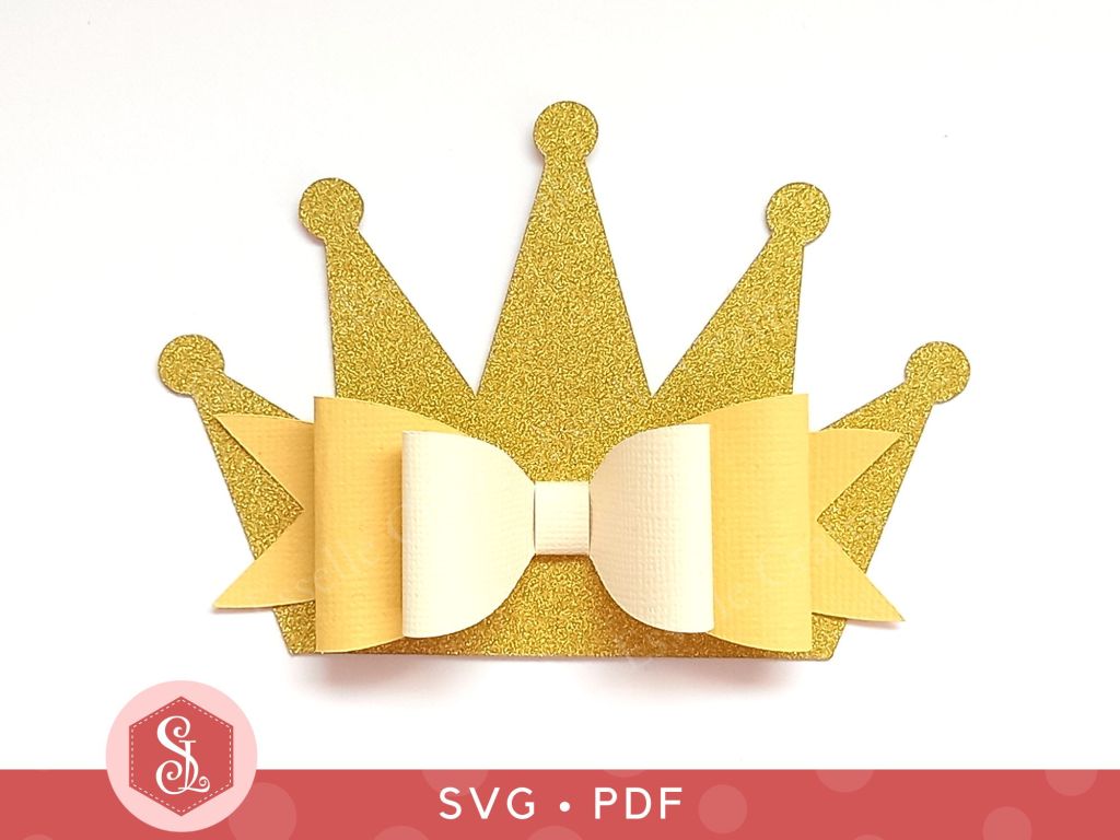 A princess crown bow made from gold glitter cardstock that can be used on gift packaging or home decor
