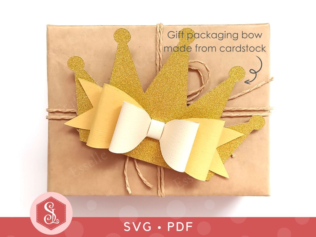 A princess crown bow made from gold glitter cardstock that can be used on gift packaging or home decor
