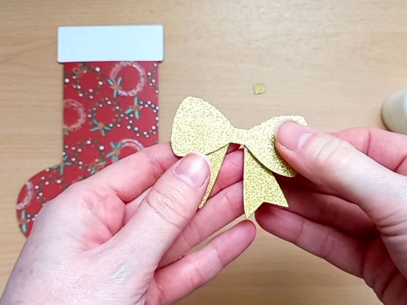 Making a festive paper craft gift card holder in the shape of a Christmas stocking
