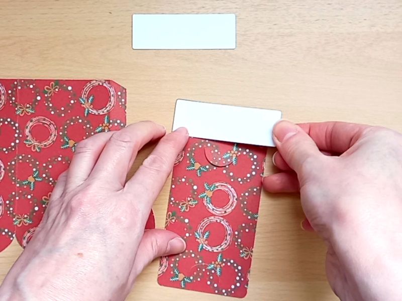 Making a festive paper craft gift card holder in the shape of a Christmas stocking