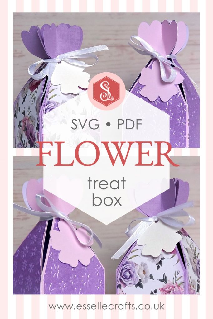 Two papercraft favour boxes in the style of a flower made from lavender paper and closed with a satin ribbon