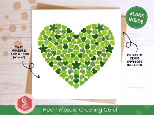 A square greeting card with a green mosaic heart design on the front made from small pieces of upcycled paper packaging.