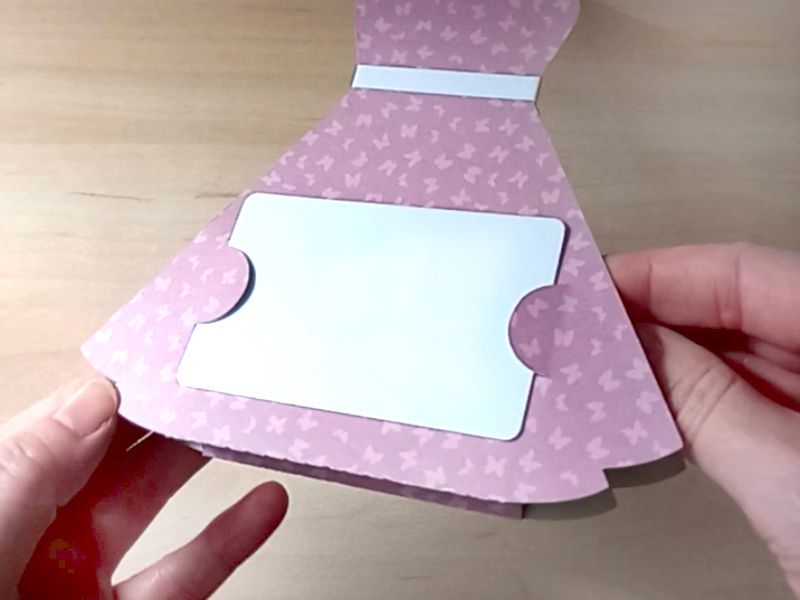 A papercraft gift card holder in the style of a vintage pink dress.