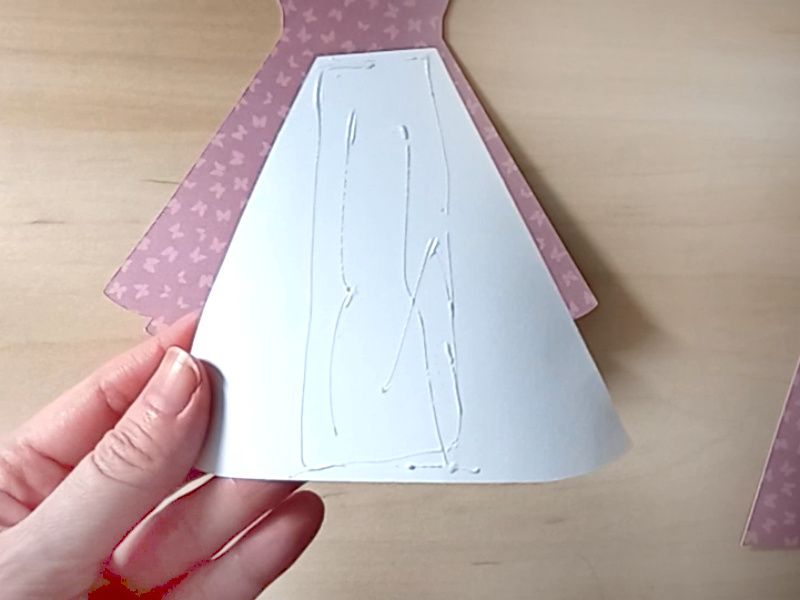 A papercraft gift card holder in the style of a vintage pink dress.
