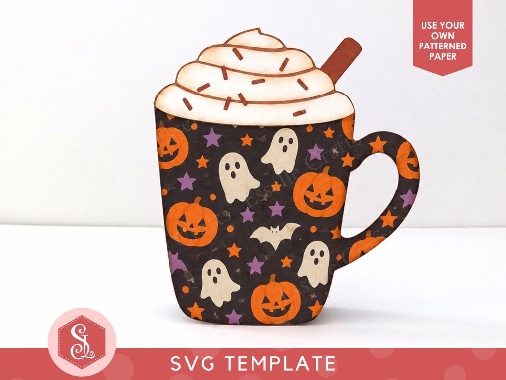 A papercraft gift card holder in the style of a pumpkin spice latte mug. It has spooky Halloween ghosts, bats and pumpkins on of the mug and is topped with white paper whipped cream, a brown paper cinnamon stick and dark brown paper sprinkles.