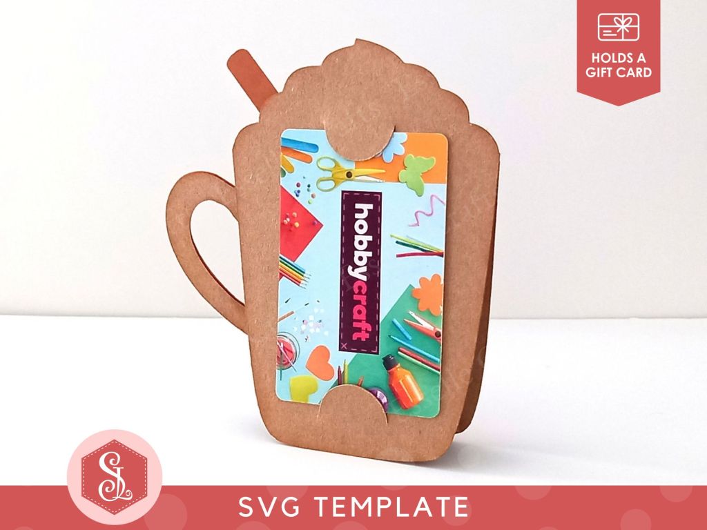 A papercraft gift card holder in the style of a pumpkin spice latte mug. It is showing a Hobbycraft gift card in the back.