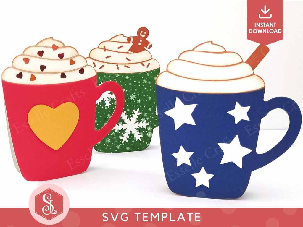 Three papercraft gift card holders in the shape of a cosy Christmas mug. They are decorated with stars, hearts and snowflakes and are topped with white paper whipped cream, a brown paper cinnamon stick and dark brown paper sprinkles.