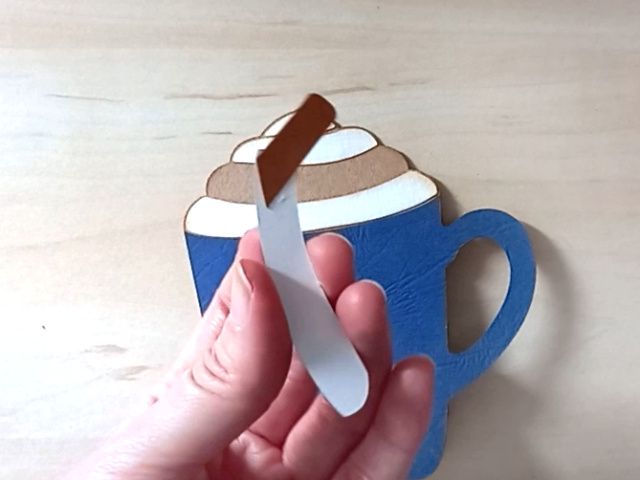 A papercraft gift card holder in the shape of a cosy Christmas mug.