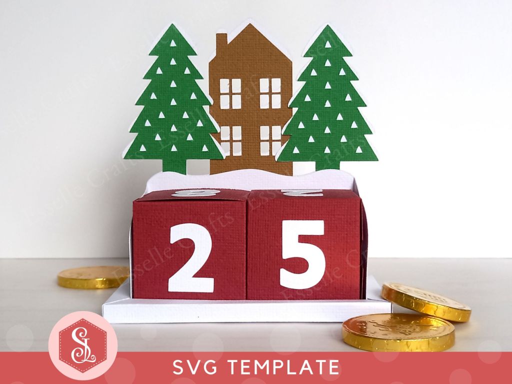 A Christmas countdown advent calendar, which comes as a DIY papercraft template, featuring a central house, two pine trees, and two numbered blocks that double up as gift boxes. It can be refilled and reused each year.